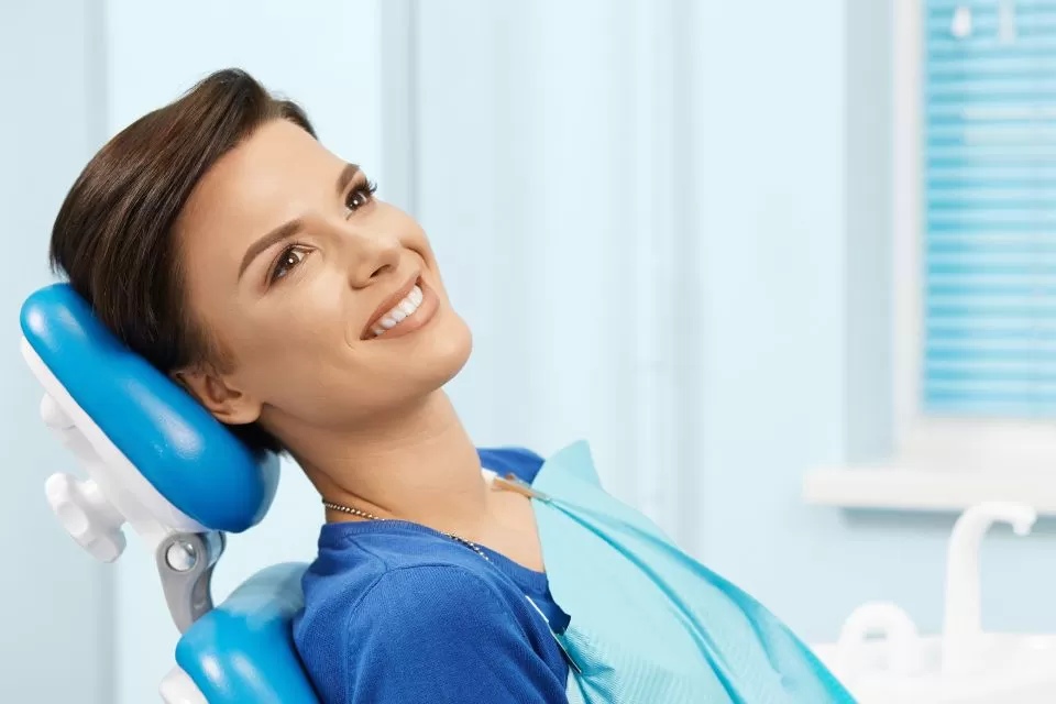 Smiling woman on dentist chair