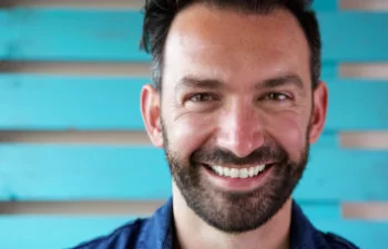 smiling man beard and nice teeth